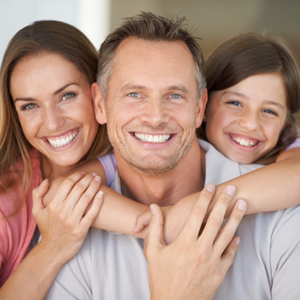 A smiling family at Surprise Oral & Implant Surgery in Surprise, AZ