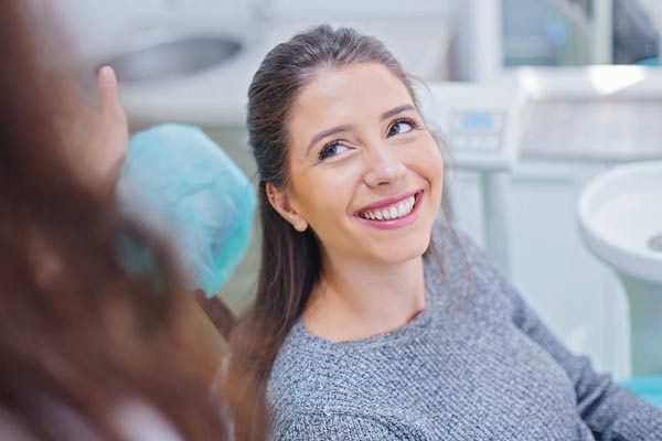Woman smiling while at Surprise Oral & Implant Surgery in Surprise, AZ